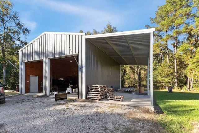 view of outdoor structure featuring a lawn