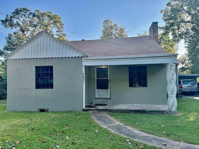 bungalow-style home with a porch and a front lawn