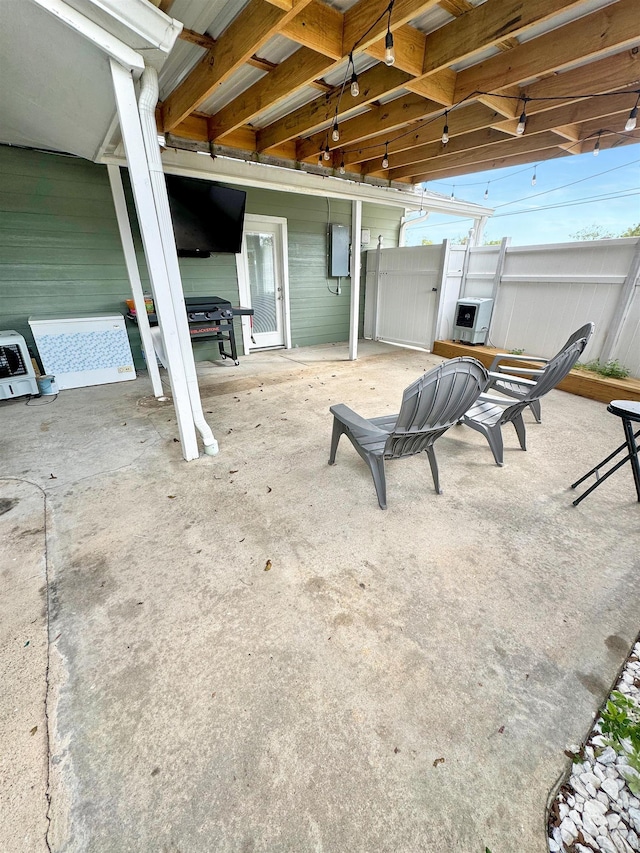 view of patio with electric panel