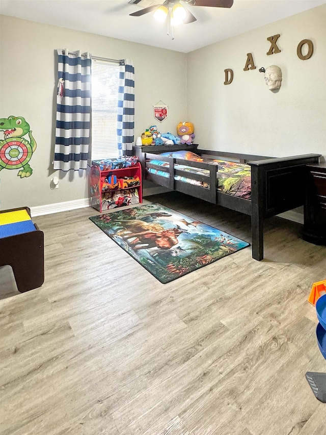 bedroom featuring ceiling fan and wood-type flooring