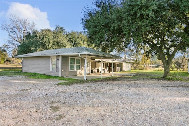 view of front facade with a patio area