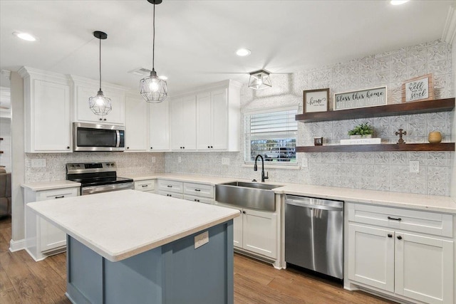 kitchen featuring sink, white cabinetry, and stainless steel appliances