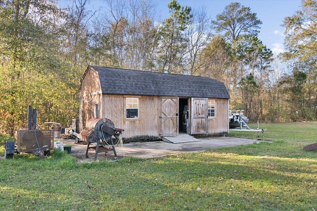 view of outdoor structure with a lawn