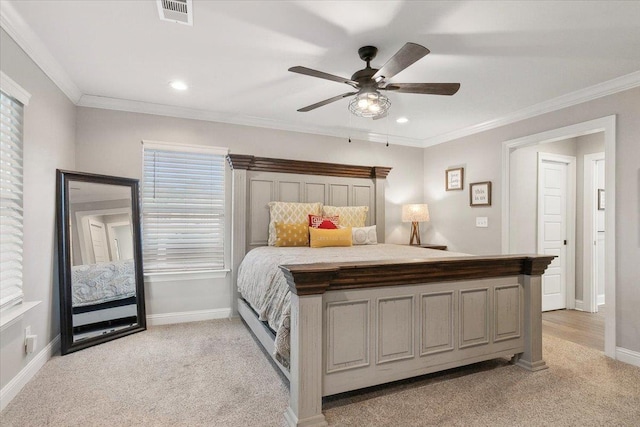 bedroom featuring ceiling fan, light colored carpet, crown molding, and multiple windows