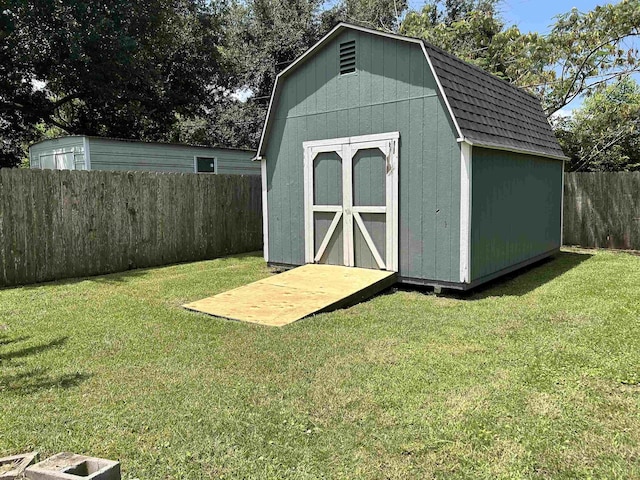 view of outdoor structure with a lawn