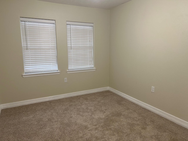 unfurnished room with carpet floors