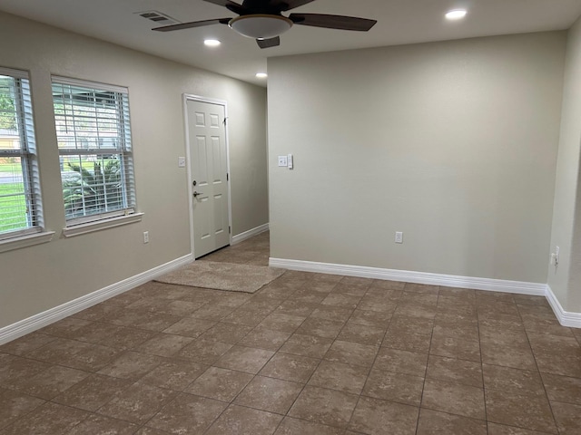 unfurnished room with ceiling fan