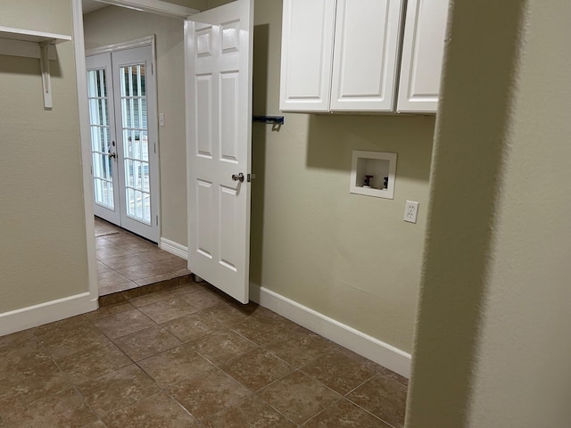 laundry room with hookup for a washing machine, french doors, cabinets, and dark tile patterned flooring