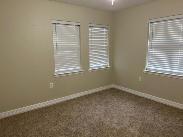 empty room with carpet flooring