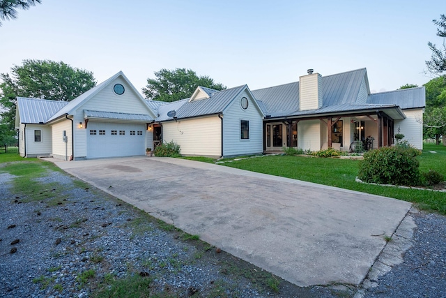 view of front of home featuring a front yard and a garage