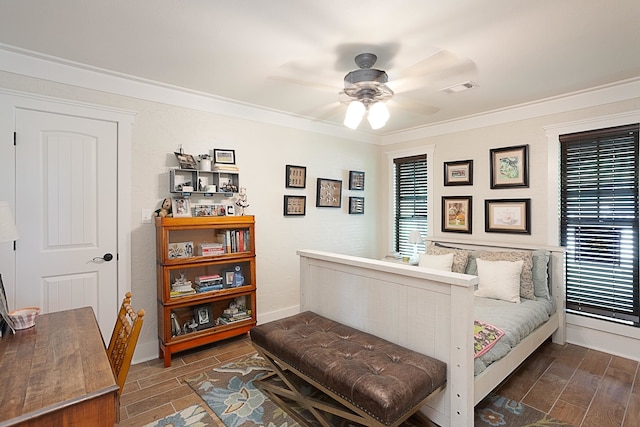 bedroom with ceiling fan and crown molding