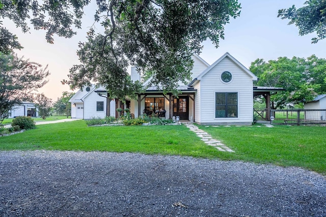 view of front facade with a garage and a lawn