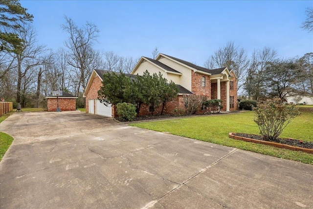 view of side of home featuring a garage, driveway, brick siding, and a lawn