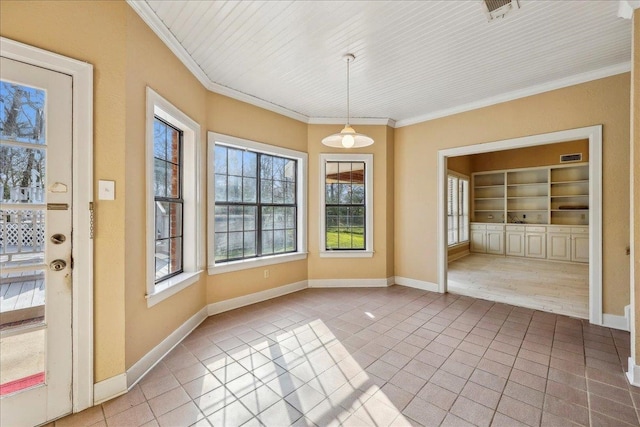 unfurnished dining area featuring crown molding, baseboards, built in features, and tile patterned floors