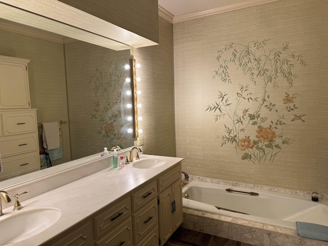 bathroom featuring vanity, crown molding, and tiled bath