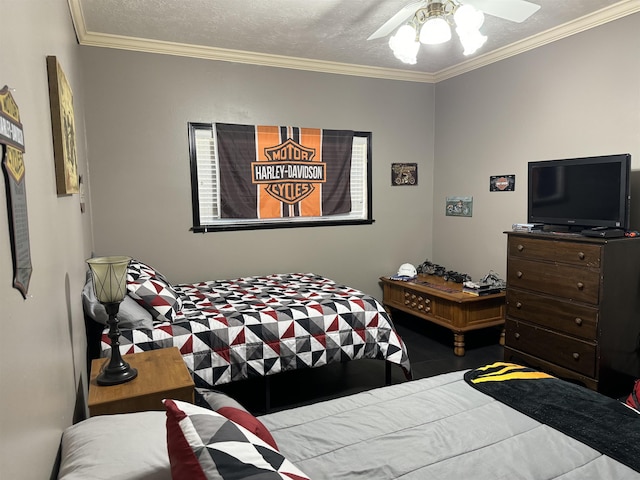 bedroom with ceiling fan, crown molding, and a textured ceiling