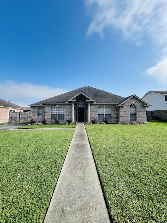 7060 Westgate Dr, Beaumont, TX 77706 - ranch-style home with brick siding and roof with shingles