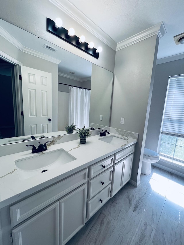 7060 Westgate Dr, Beaumont, TX 77706 - full bathroom featuring crown molding, marble tiled flooring, toilet, double vanity, and curtained shower