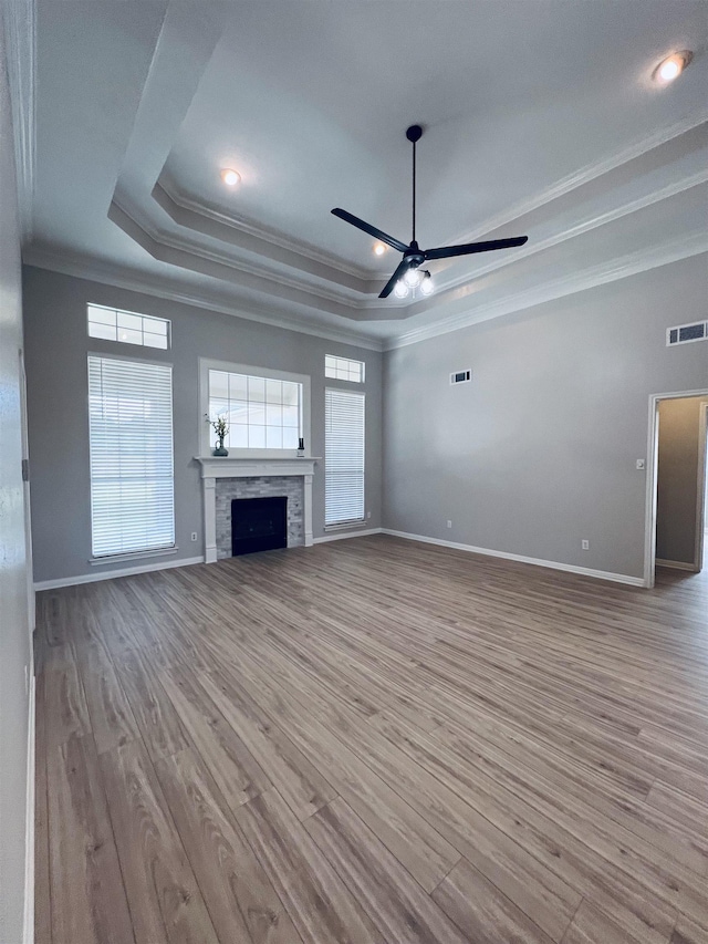 7060 Westgate Dr, Beaumont, TX 77706 - unfurnished living room with ornamental molding, a ceiling fan, baseboards, a tray ceiling, and recessed lighting