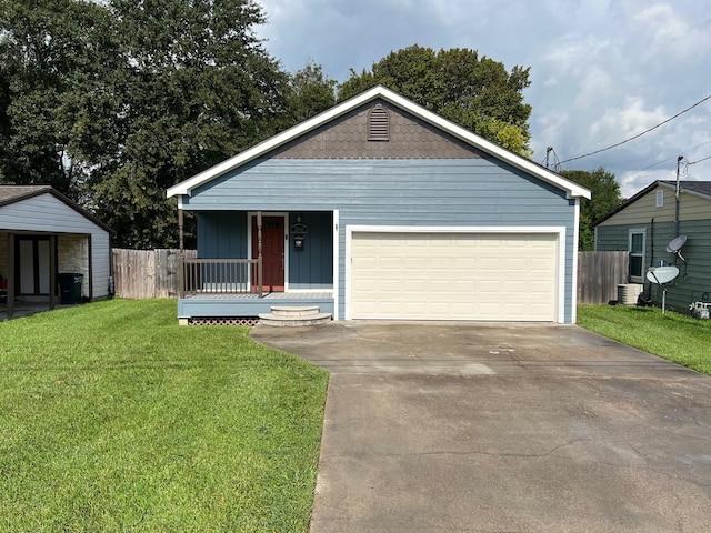 view of front of house featuring covered porch, a front yard, and a garage