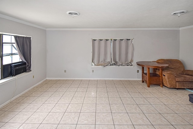 spare room featuring light tile patterned floors, cooling unit, and crown molding