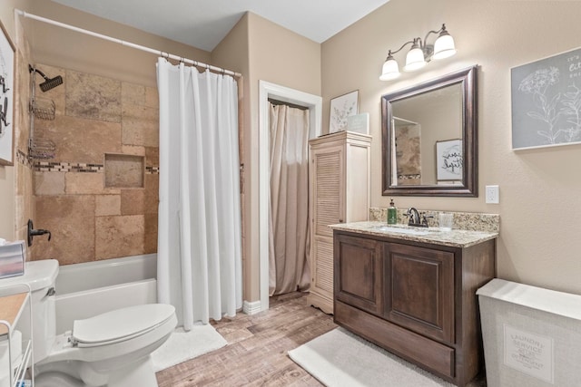 8395 Carrie Ln, Beaumont, TX 77713 - bathroom with wood finished floors, vanity, and shower / bathtub combination with curtain