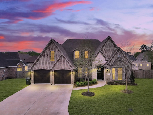 8395 Carrie Ln, Beaumont, TX 77713 - french country home with brick siding, concrete driveway, and stone siding