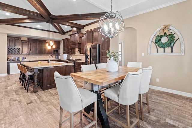 8395 Carrie Ln, Beaumont, TX 77713 - dining space featuring a chandelier, light wood finished floors, recessed lighting, and beamed ceiling