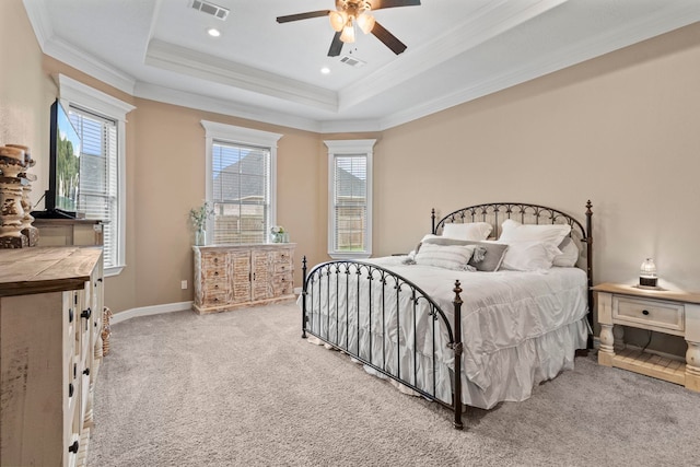 8395 Carrie Ln, Beaumont, TX 77713 - carpeted bedroom featuring a tray ceiling, multiple windows, ornamental molding, a ceiling fan, and recessed lighting
