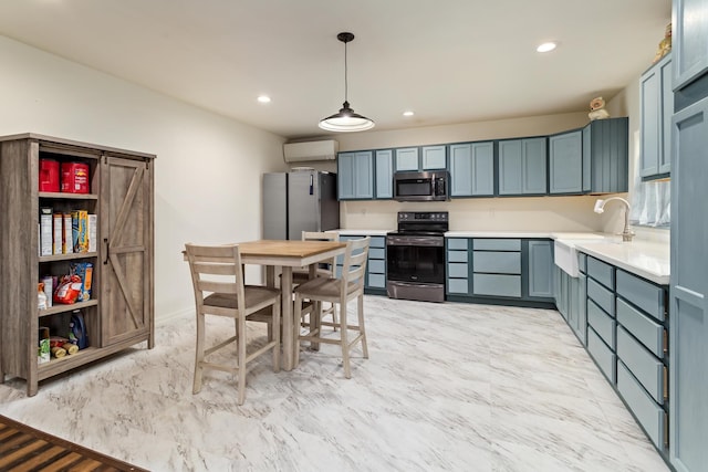 kitchen featuring pendant lighting, stainless steel appliances, blue cabinets, and a wall unit AC