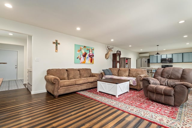 living room with dark carpet and an AC wall unit