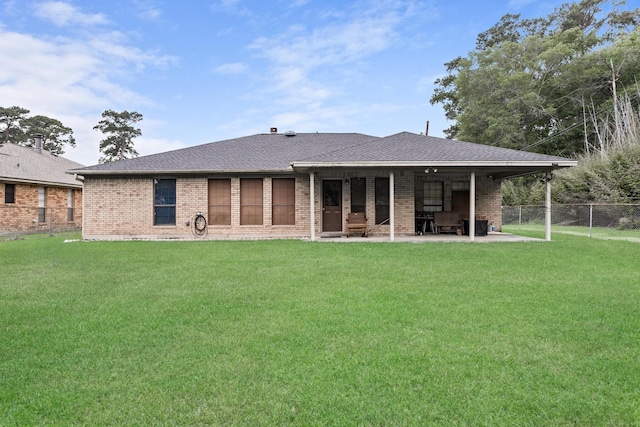 6690 Hackberry Dr, Beaumont, TX 77708 - back of house with brick siding, a patio, and roof with shingles