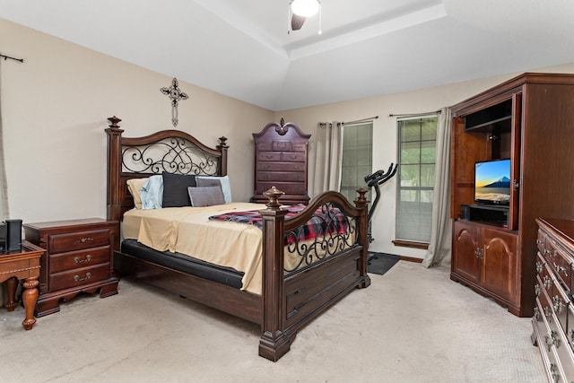 6690 Hackberry Dr, Beaumont, TX 77708 - bedroom featuring light colored carpet, a raised ceiling, and a ceiling fan