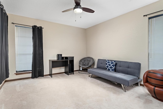 6690 Hackberry Dr, Beaumont, TX 77708 - living area featuring carpet, ceiling fan, and baseboards