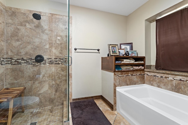 6690 Hackberry Dr, Beaumont, TX 77708 - bathroom with a bath, a shower stall, tile patterned flooring, and baseboards