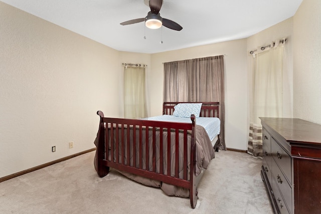 6690 Hackberry Dr, Beaumont, TX 77708 - bedroom with light colored carpet, baseboards, and ceiling fan