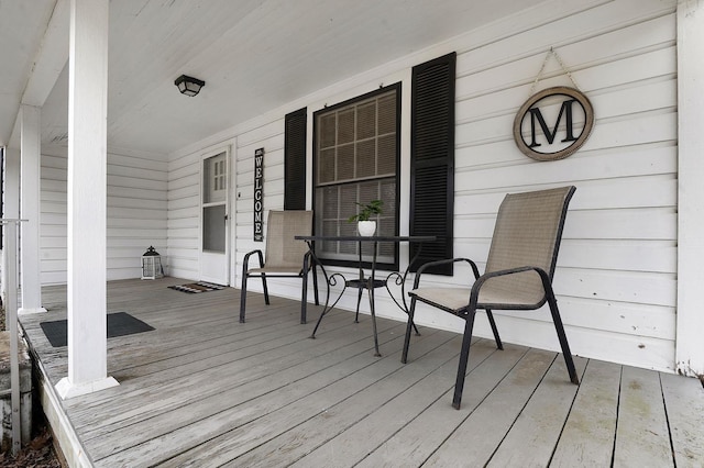 wooden terrace with a porch