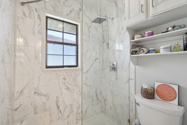 full bathroom with toilet and a marble finish shower