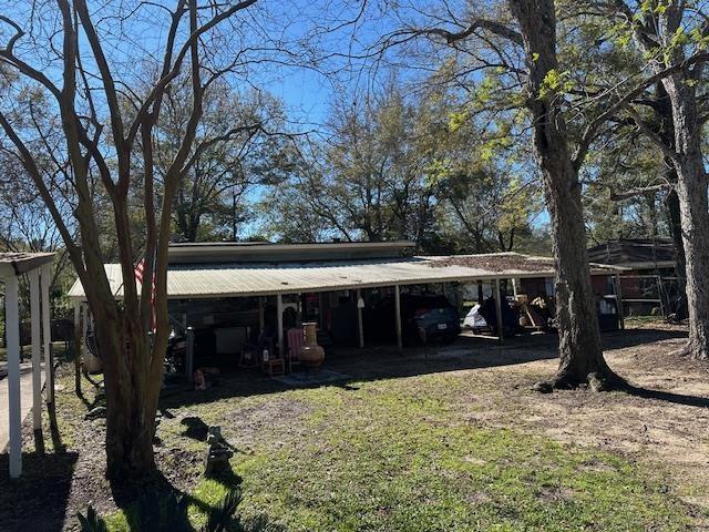 exterior space with a carport