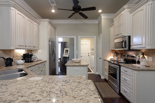 3665 Canyon Ln, Beaumont, TX 77713 - kitchen featuring appliances with stainless steel finishes, crown molding, ceiling fan, backsplash, and dark wood-style flooring