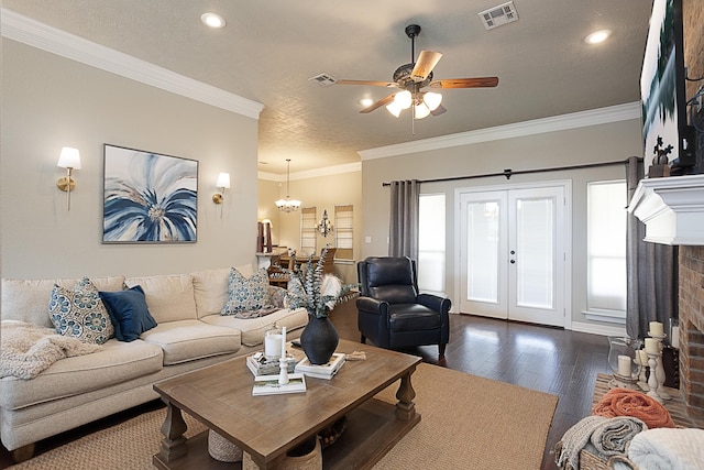 3665 Canyon Ln, Beaumont, TX 77713 - living area featuring dark wood-type flooring, a ceiling fan, a textured ceiling, ornamental molding, and french doors