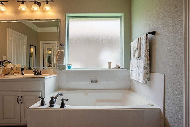 3665 Canyon Ln, Beaumont, TX 77713 - bathroom with vanity, crown molding, a bath, and a textured wall