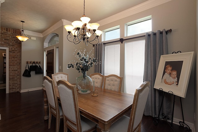 3665 Canyon Ln, Beaumont, TX 77713 - dining space with a chandelier, ornamental molding, and dark wood-style flooring