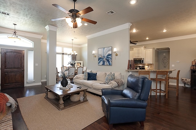 3665 Canyon Ln, Beaumont, TX 77713 - living room with ceiling fan, recessed lighting, ornamental molding, dark wood-style flooring, and a chandelier