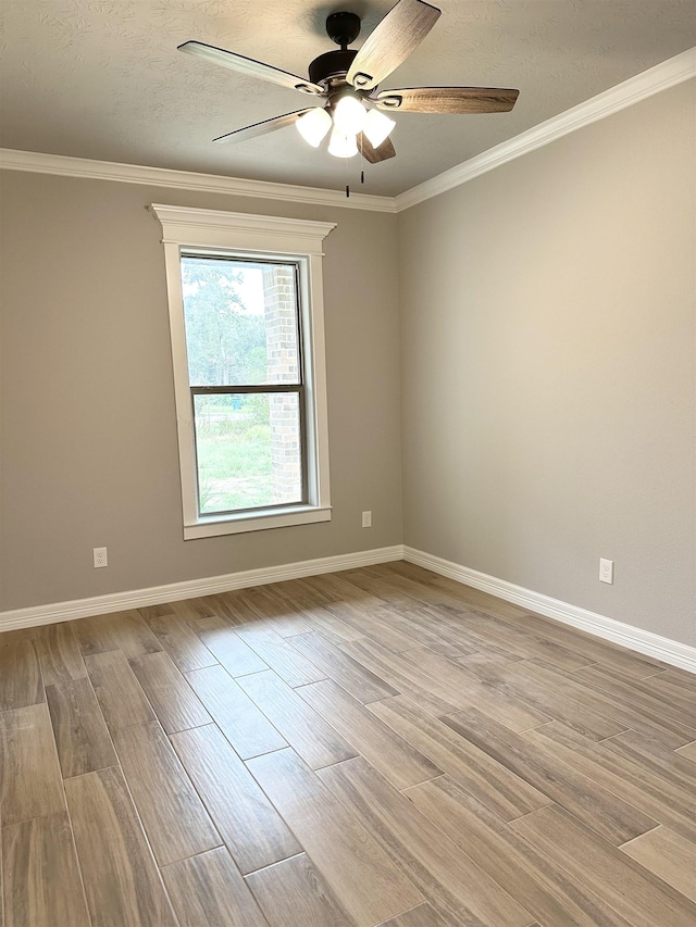 unfurnished room with light wood-type flooring, ceiling fan, and crown molding