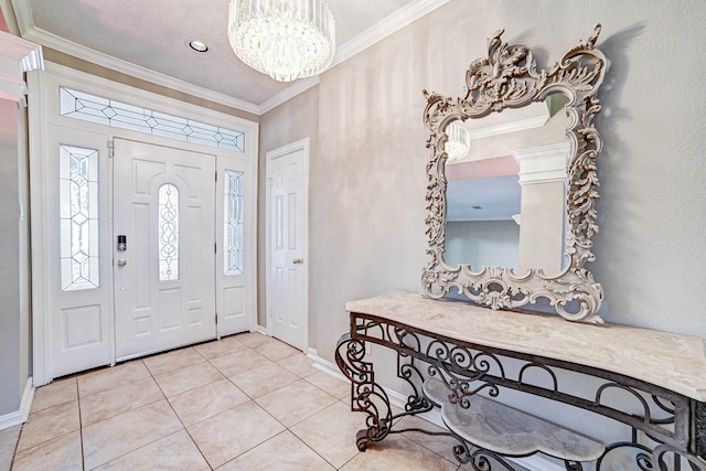 tiled foyer with a chandelier and ornamental molding