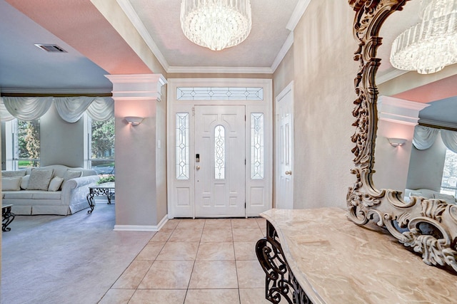 carpeted foyer entrance with crown molding, a chandelier, and a textured ceiling