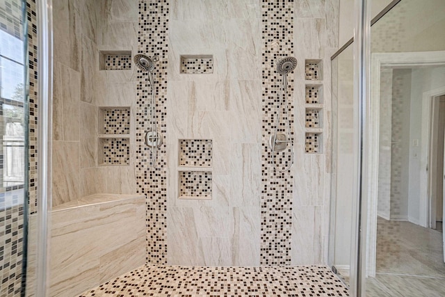 bathroom featuring a tile shower