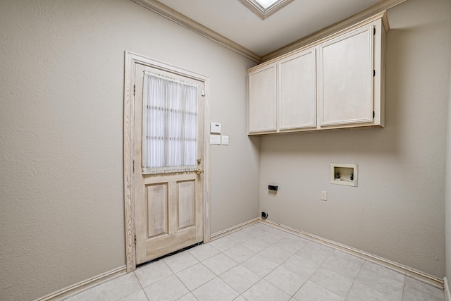 clothes washing area with hookup for an electric dryer, washer hookup, cabinets, and ornamental molding