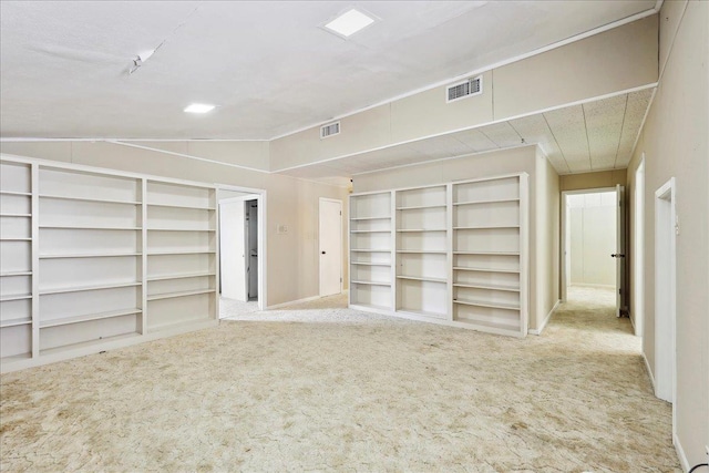 interior space with visible vents and carpet floors